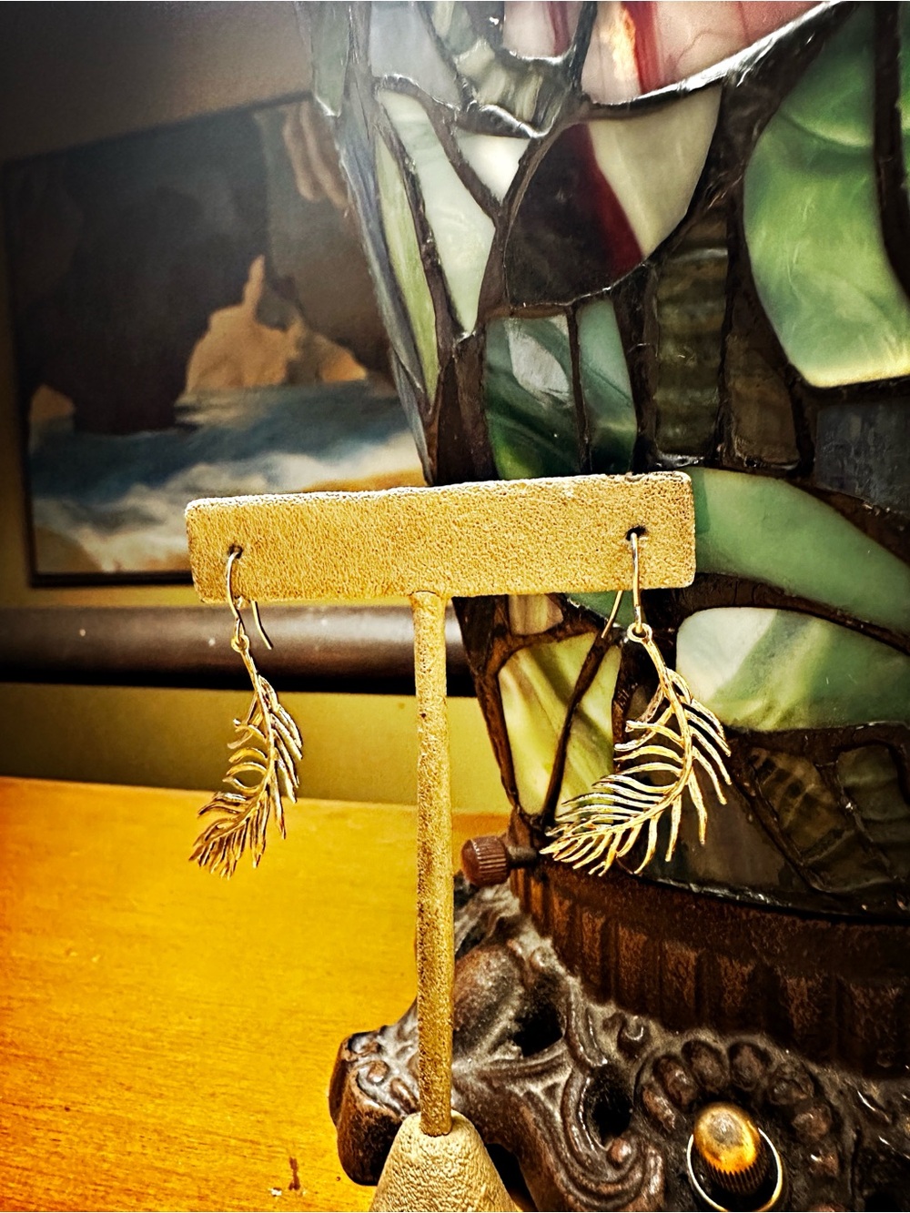 Gold Feather Earrings.